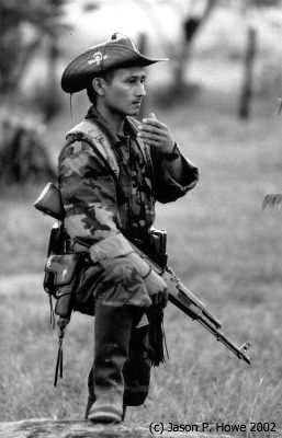 A rebel trooper standing guard during the peace negotiations at Los Posos, Caqueta.
Photo Jason P.Howe, 2002