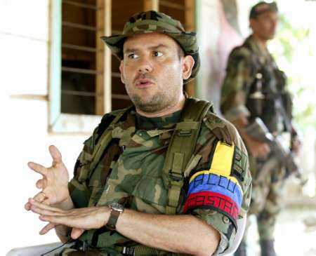 File photo of Carlos Castano, Colombia's far-right warlord, during an interview with Reuters in 
the province of Cordoba on September 5, 2002. Interpol received an arrest order to capture 
Castano on Thursday 19 Sept., as well as his second in command, Salvatore Mancuso and another 
paramiltary commander, Hector Buitrago. It is the first time that the group, who fought against 
armed leftist militants, have been accused of homicide and kidnapping. More than 40,000 
have been killed in the last decade alone during armed conflicts in Colombia. 
REUTERS/Jose Miguel Gomez/FILE